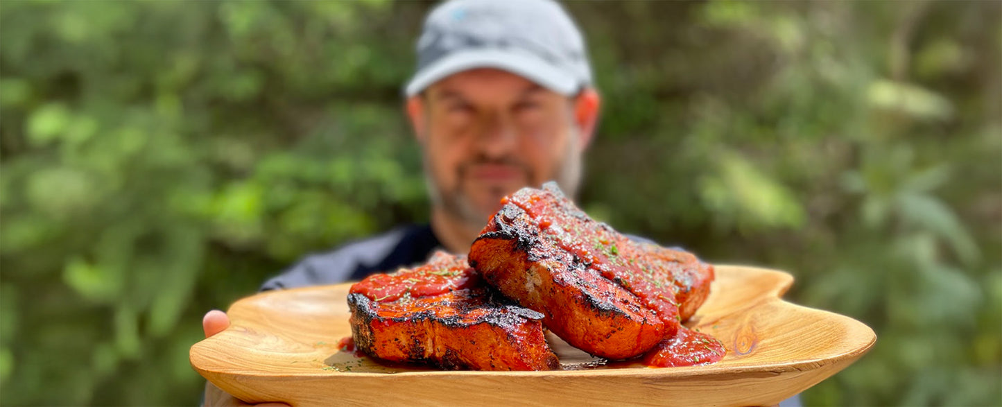 Grilled pork chops on a SnS Grills Kettle