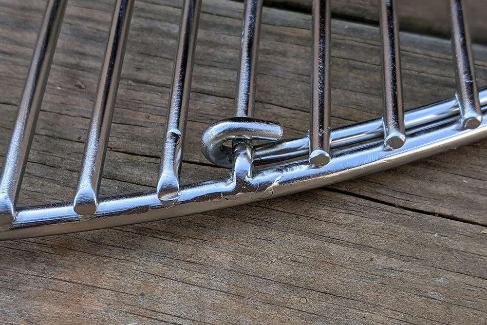 
                  
                    Designed to match the width of the Slow 'N Sear® XL, the single opening streamlines grate functionality while making it easier to access fuel in the basket. Two-zone cooking enthusiasts and Cold Grate Technique lovers rejoice! Made from high quality 304 stainless steel, this grate will simplify and elevate any cook.  | SnS Grills
                  
                